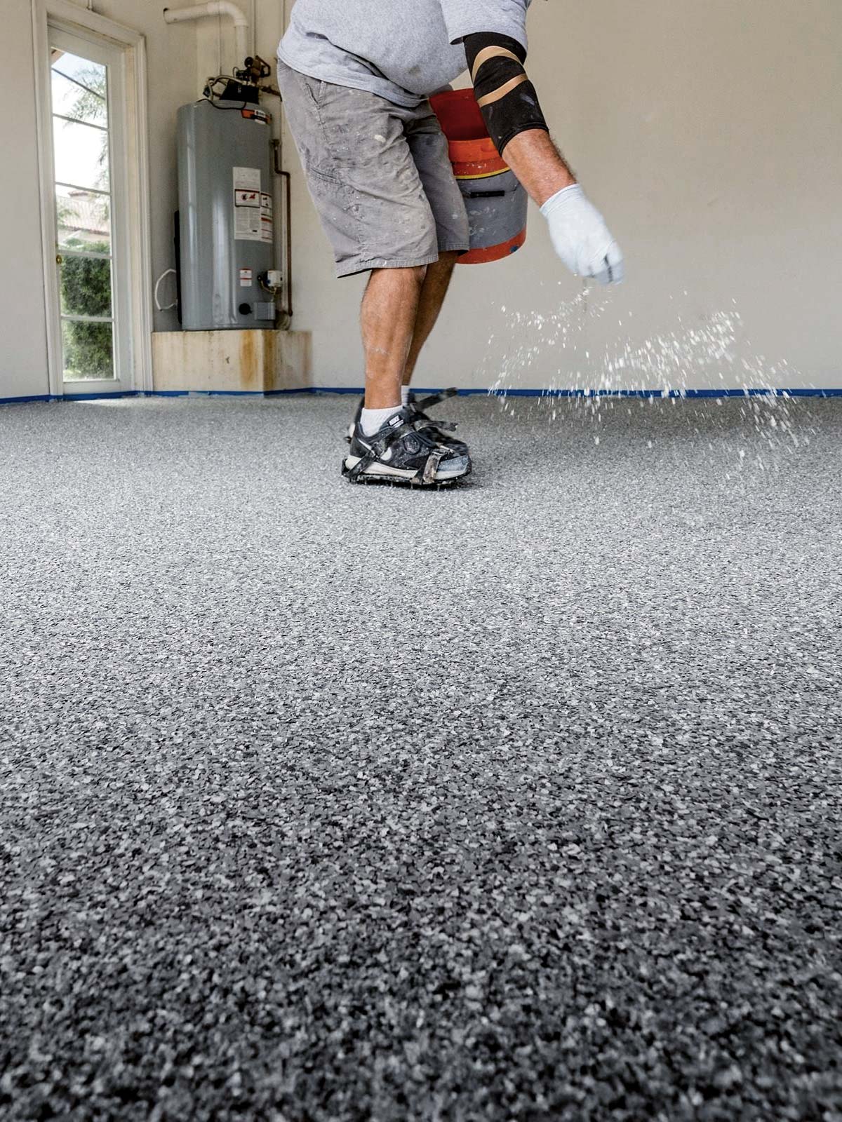 garage floor specialist sprinkling chips on floor